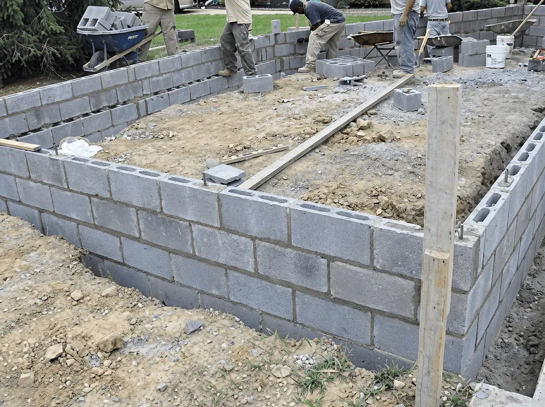 Professionals building a foundation with blocks in Detroit, MI